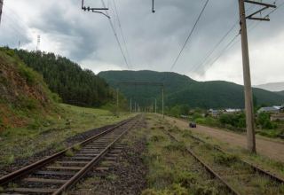 Freight wagons of Georgian railway train carrying raw sugar to Azerbaijan rolled over