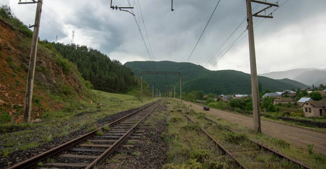 Freight wagons of Georgian railway train carrying raw sugar to Azerbaijan rolled over